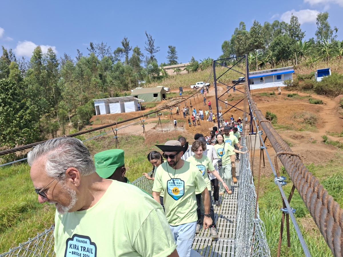 Some of the supporters who donated funds, seen here cross the newly constructed 75-metre Kira trail bridge during the inauguration in Gasogi in Gasabo District. Courtesy