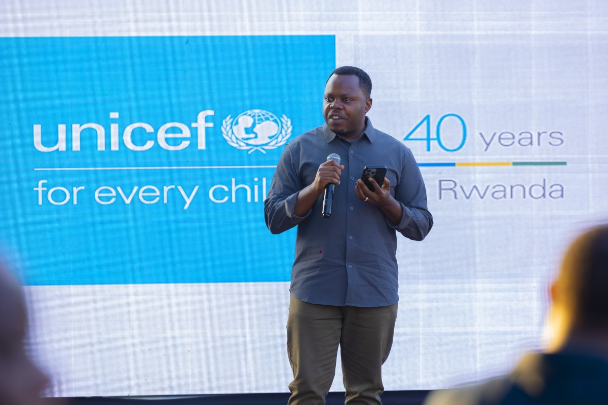 Minister of Youth and Arts Jean-Népo Abdallah Utumatwishima addresses participants at the event, commending UNICEF Rwanda's lasting impact on children's lives. Photo by Kellya Keza