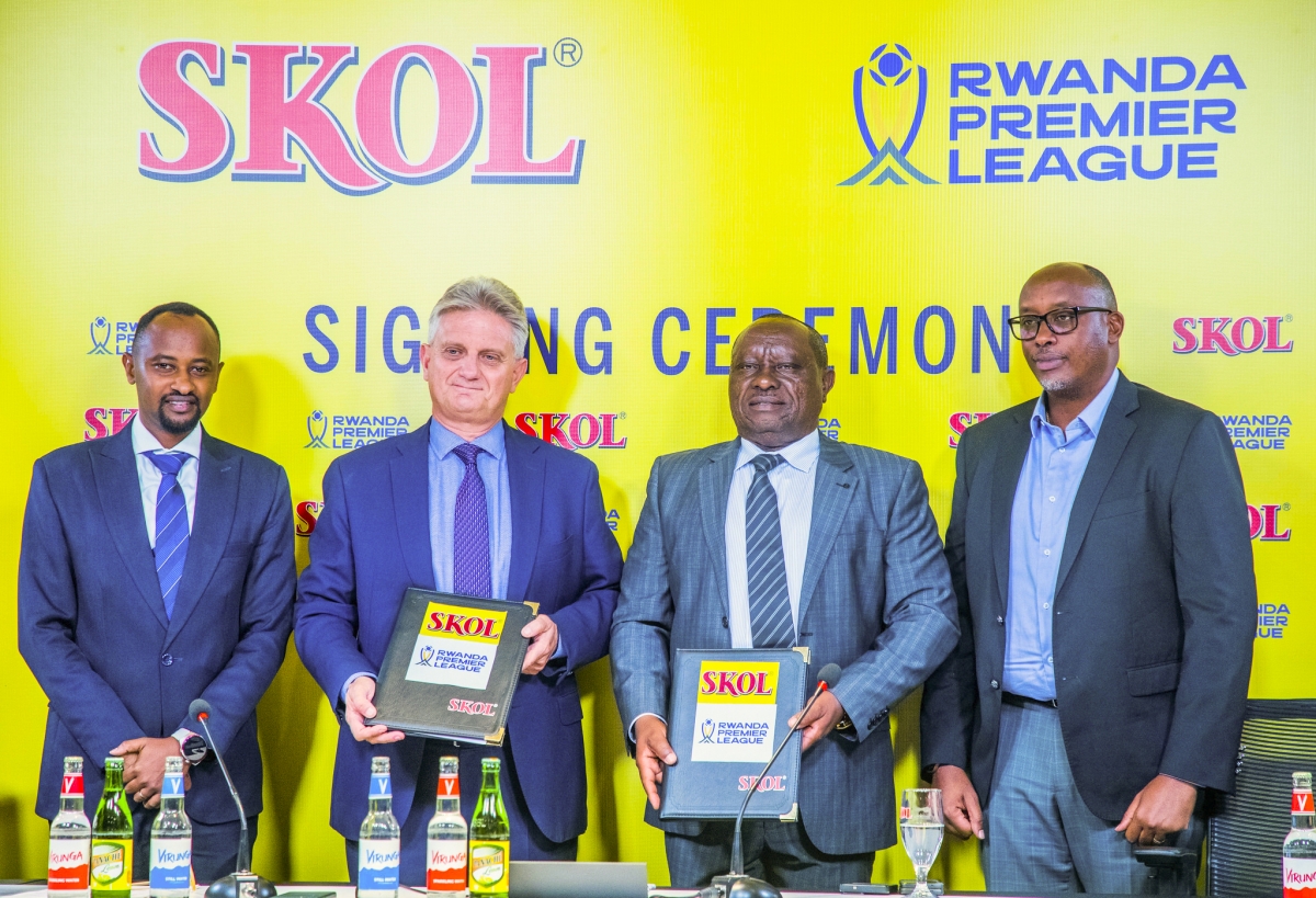 Officials pose for a photo at the signing ceremony.