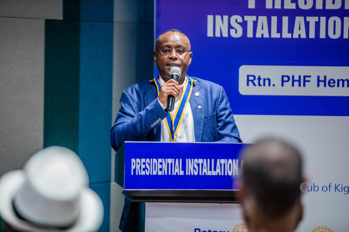 The outgoing president PHF. Rtn Samuel Nzeki Munyao, addresses members of the club during the ceremony.