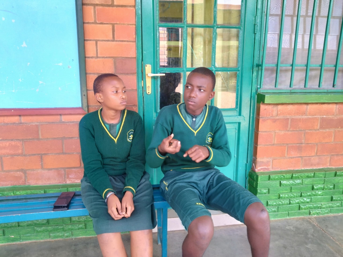 Akhibaru Mugengasaye (right), one of the students with hearing and speaking impairment who sat for PLE exams. He said the exams were relatively easy.