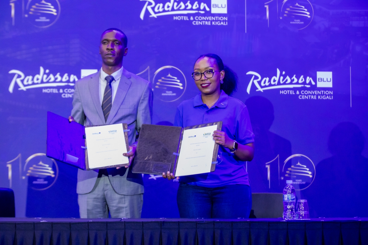 Avega agahozo, Etienne Kalisa, Executive Director and Nice Uwase , Acting General Manager during the signing ceremony. Photo by Kellya Keza