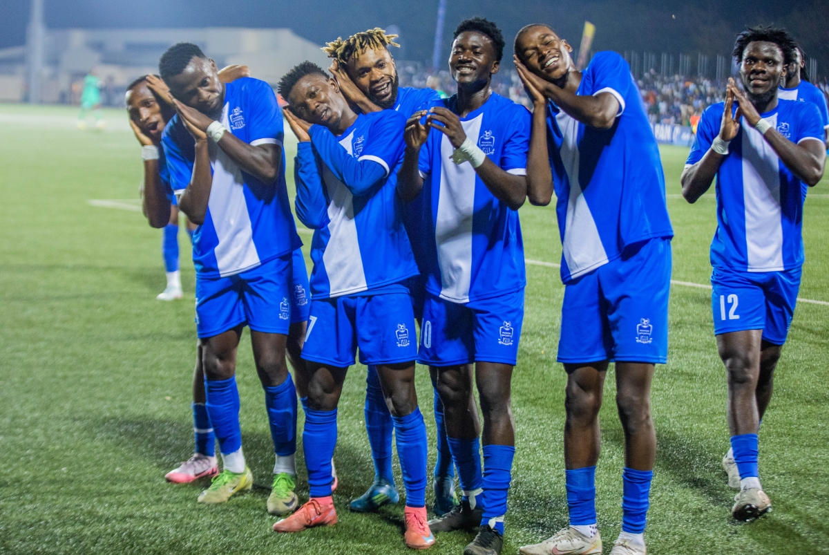Rayon Sports players celebrate together after the final whistle, delighting their supporters. Craish Bahizi