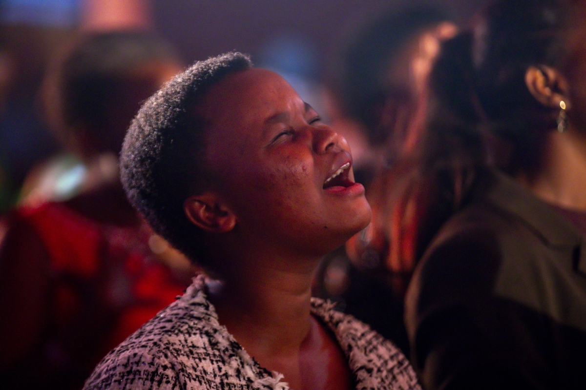 One of the worshipers who turned up for Habwa umugisha album launch, captured here during a praise and worship session.