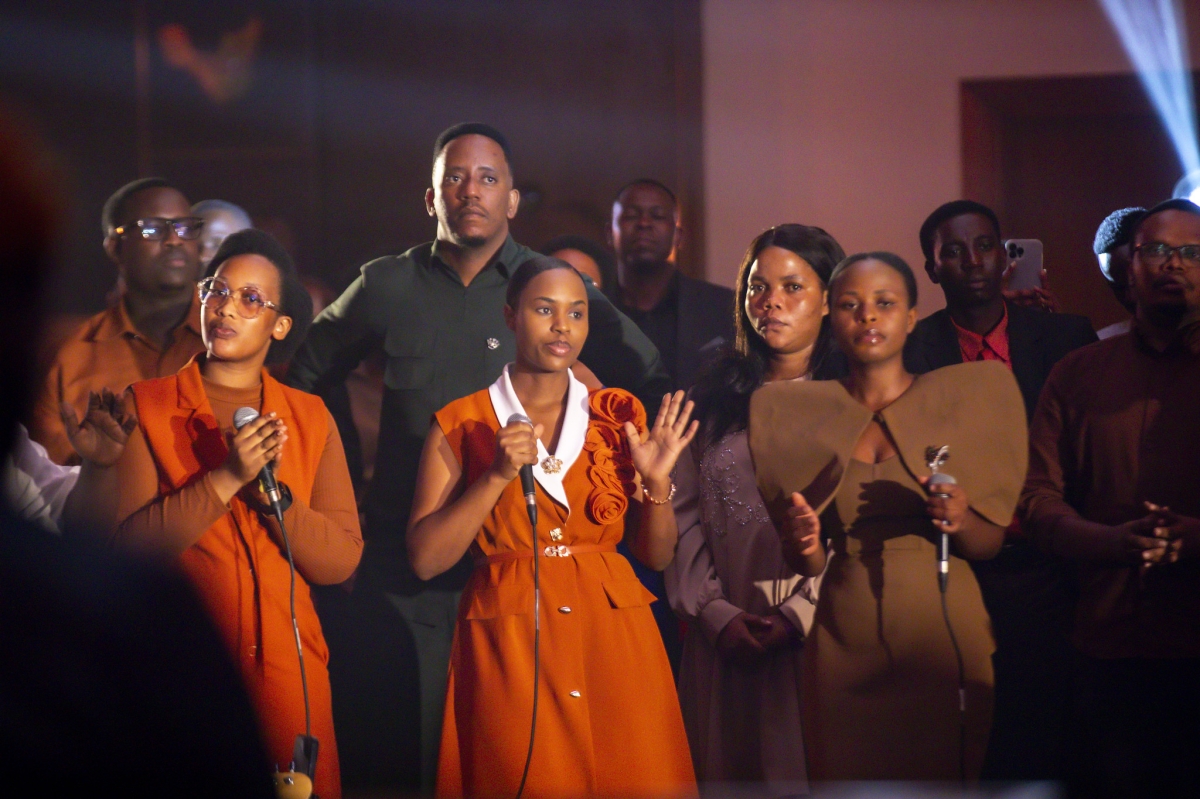 Attendees worshiping God.