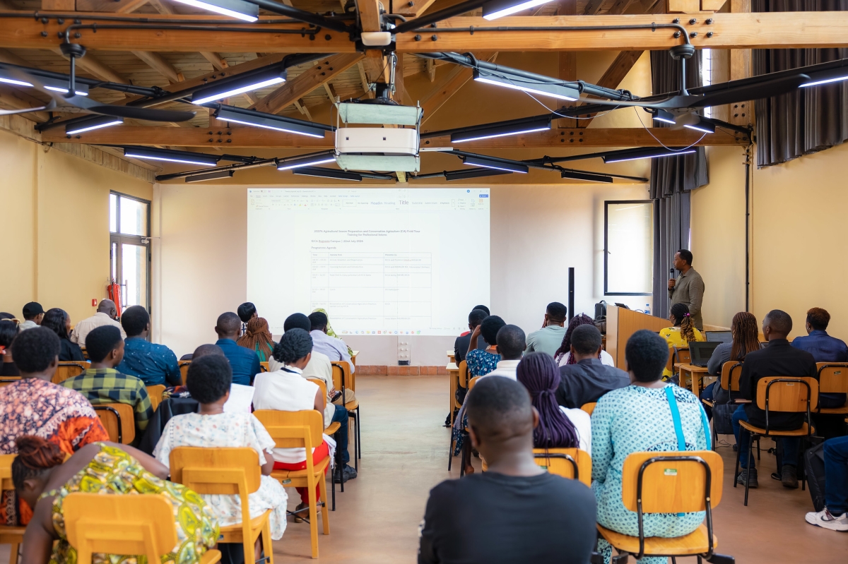 Trainees follow a presentation during a session.