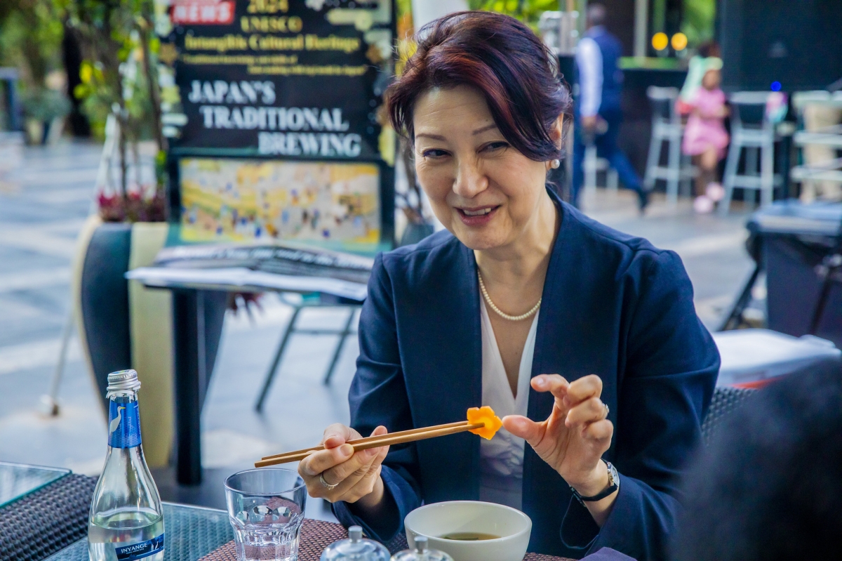 A participant tastes one of the dishes at the Japanese “Washoku” Culinary Demonstration.