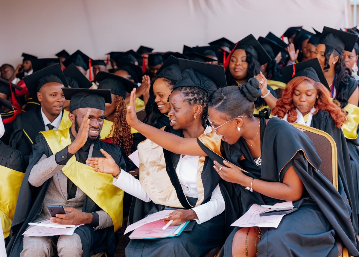 A cheerful moment as graduates celebrate together during the graduation ceremony in Kigali.