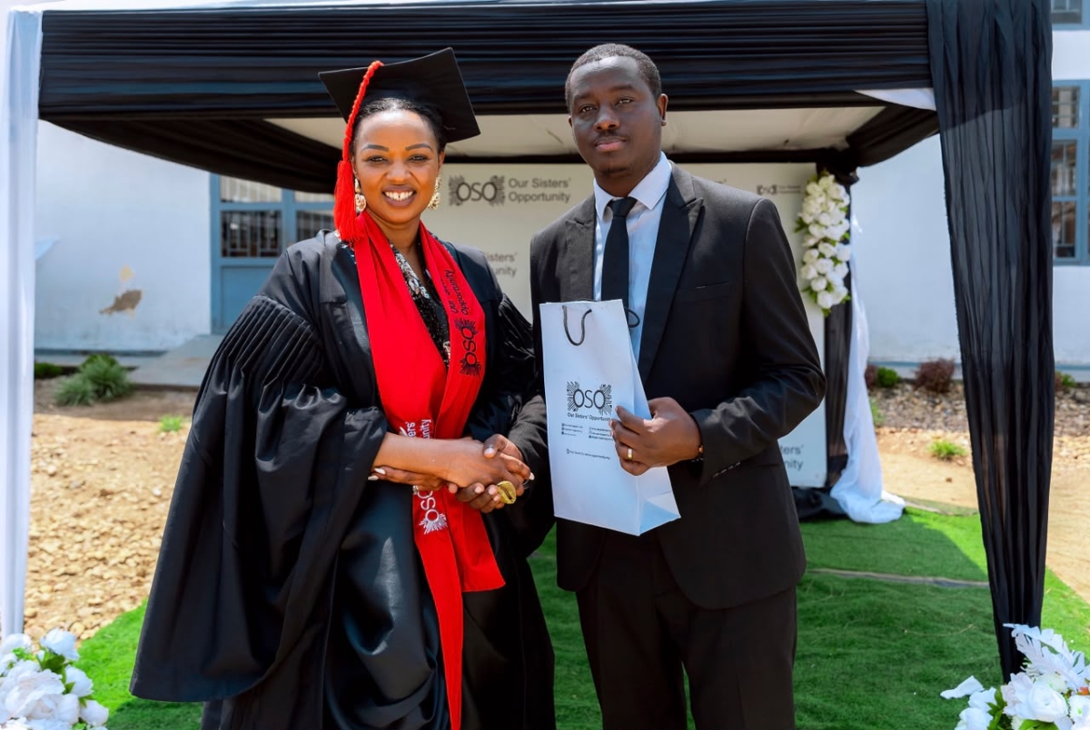 Eugène Uwimana, TVET Skills Development Manager at the Rwanda TVET Board, receives a token of appreciation from OSO founder Delphine Uwamahoro at the event. Courtesy photo.