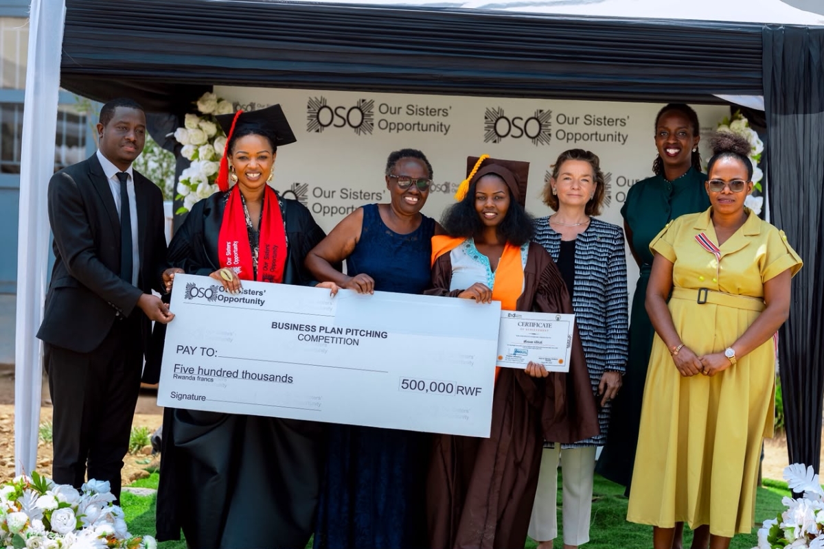 Gloriose Utuje (centre), awarded third place for the best business project among the graduates, poses with partners at the event. Courtesy photo.