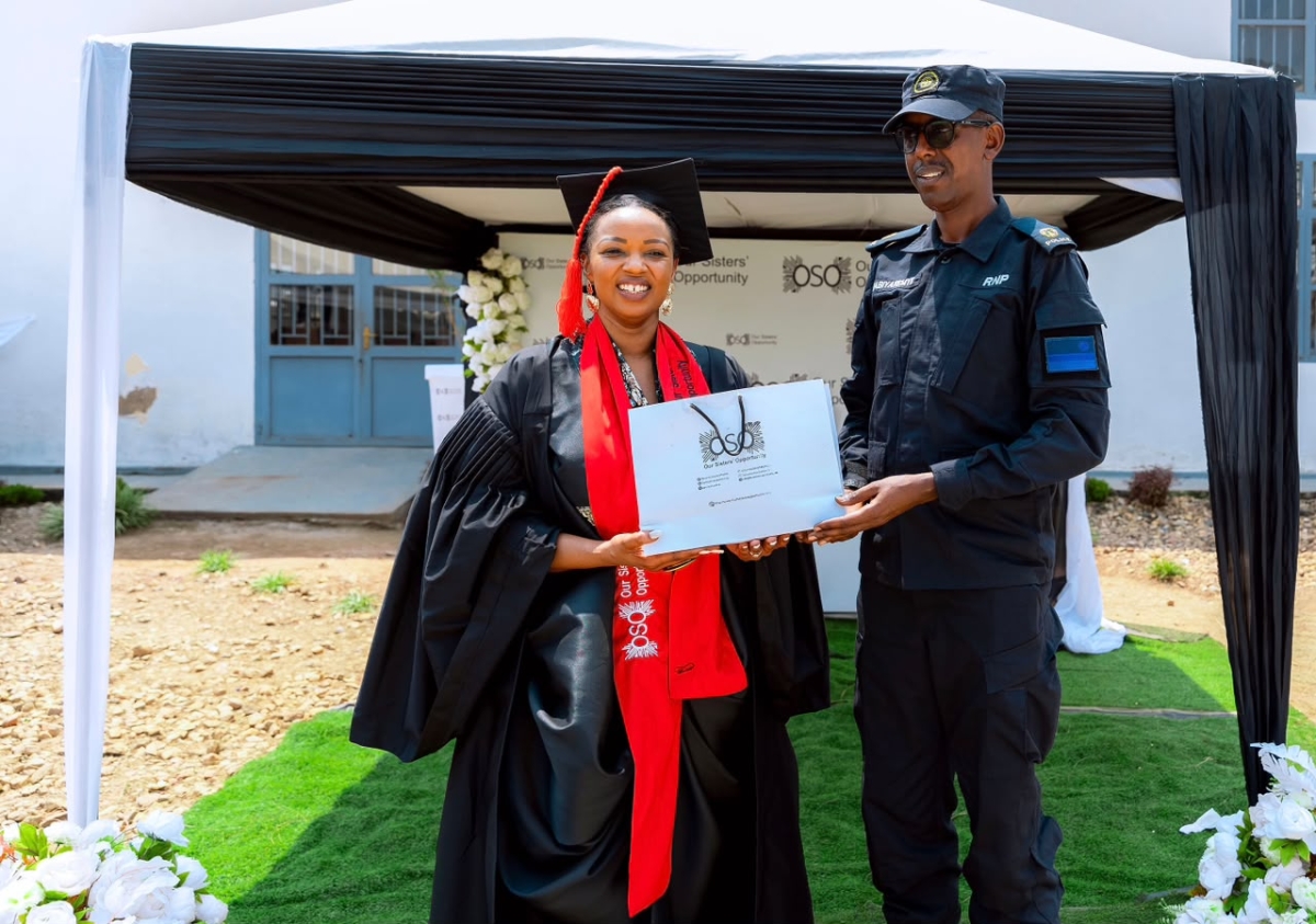 OSO founder Delphine Uwamahoro presents a token of appreciation to a representative of the Rwanda National Police, representing other security organs, at the event. Courtesy photo,