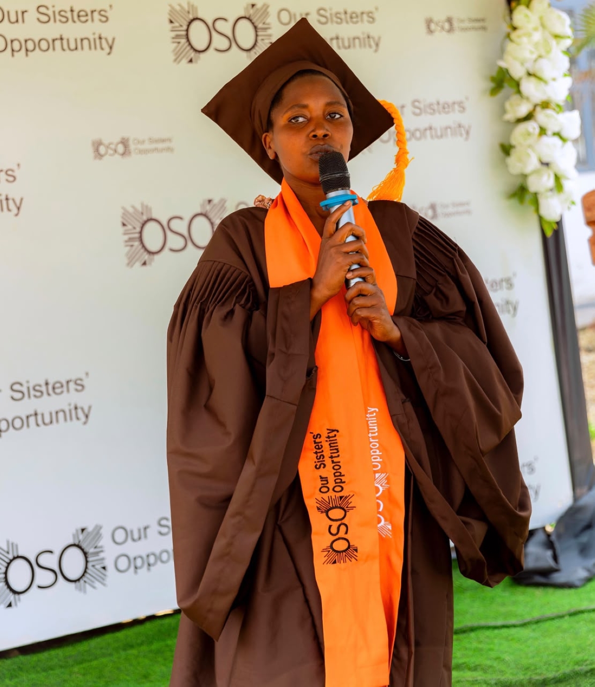 Esther Mushimiyimana, the graduates’ representative, speaks at the event. Courtesy photo.