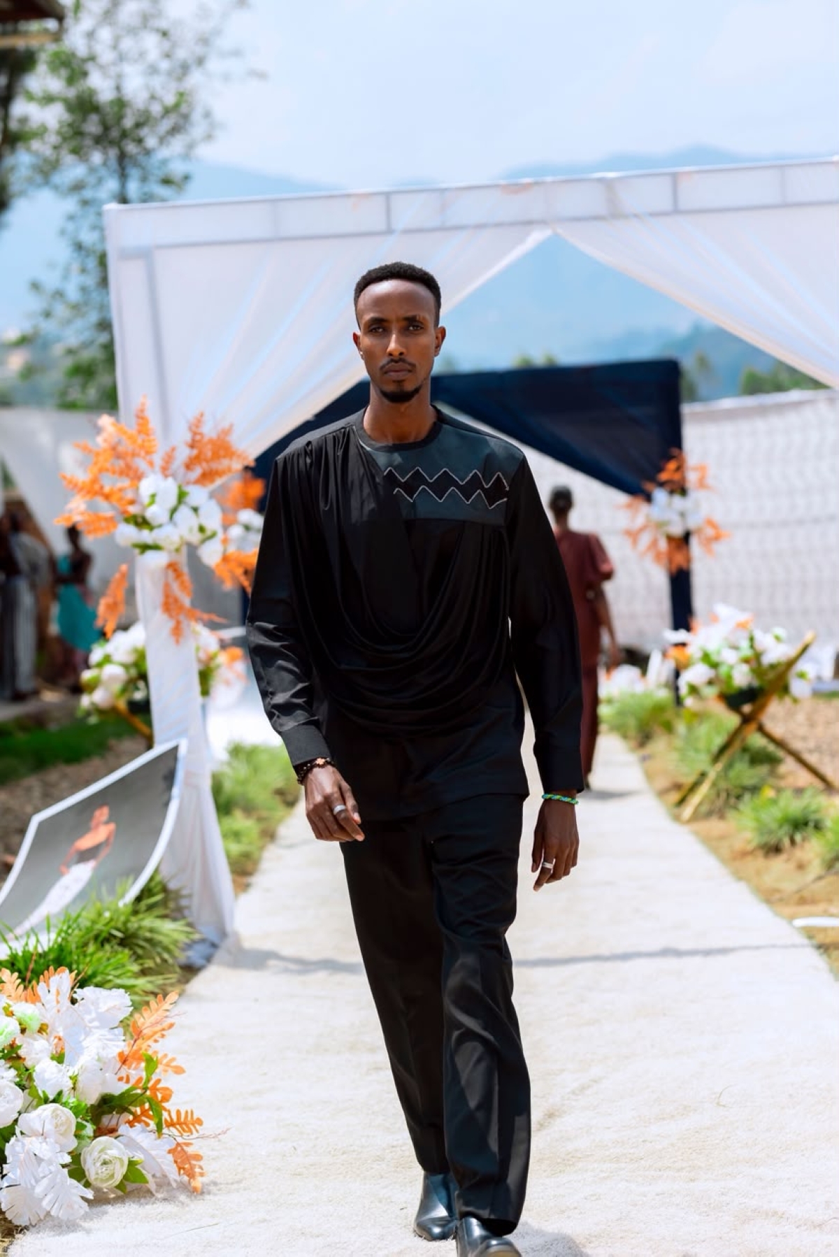 A model presents a garment designed and made by OSO students Courtesy photo.