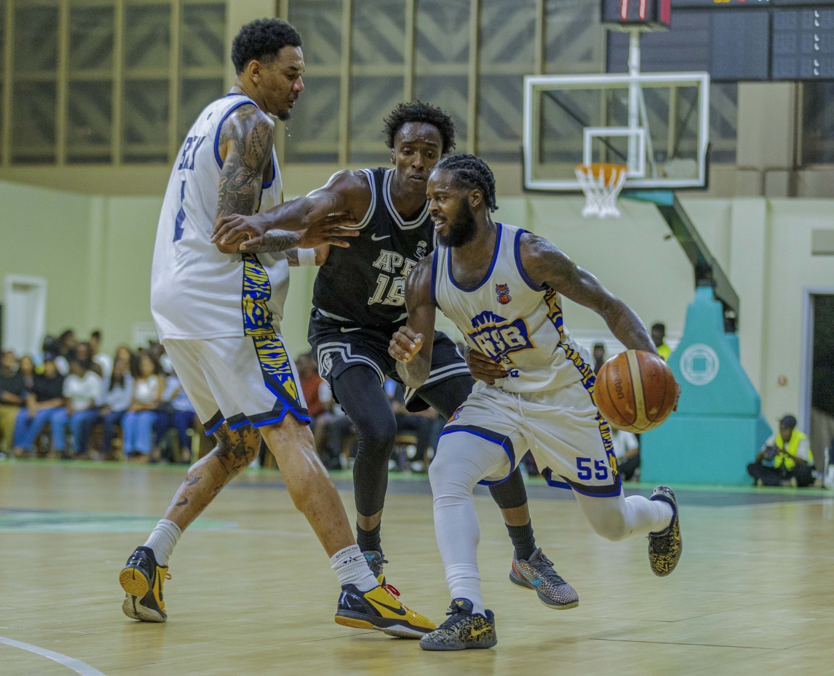 RSSB Tigers captain with the ball against APR BBC 's Ntore Habimana. Photo by Mico Elvis Ndateba