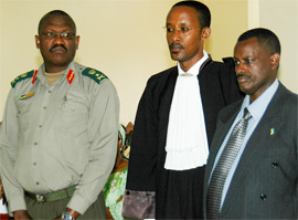 Brigadier Generals Rusagara and Kaka (right) at the Military Tribunal yesterday. Centre is Kakau2019s lawyer Athanase Rutabingwa. (Photo / G. Barya)