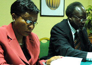 State Minister for Social Affairs Christine Nyatanyi (l), signing a MOU with Ugandau2019s Minister for Disaster Preparedness Tarsis Kabwegere in Kigali last month. (photo G Barya)
