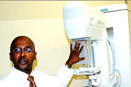 Dr. Uwimana explaining features of the newly acquired mammography machine yesterday. (Photo/ J. Mbanda)