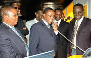 Senate President Dr Vincent Biruta tries out a videophone which will soon be introduced by MTN Rwanda on the local market. He was touring the ongoing expo at Gikondo Expo Grounds in Kigali before opening it yesterday. Left is MTN Rwanda Chief Executive Of