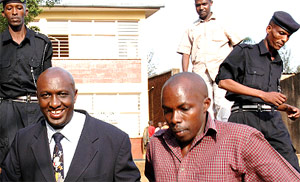 Rwigara (left) led by uniformed and non-uniformed policemen after yesterdayu2019s court session in Nyarugenge. (Photo/J. Mbanda)