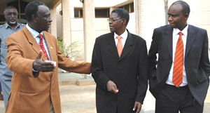 MP Medard Rutijanwa speaks to Polisi (c) while Vice Senate President Prosper Higiro looks on yesterday at Parliamentary Buildings in Kimihurura. (Photo/G. Barya)