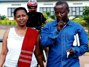 WIFE AND HUSBAND: Embattled Pastor Charles Murenzi and his wife Jolly leave CID headquarters yesterday. (Photo/ J. Mbanda)