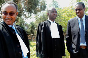 Mitali (right) and his partyu2019s lawyers Kazungu (left) and Serge Kayitare outside the High Court chambers yesterday. (Photo/ G. Barya)