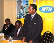 Eng. Albert  Butare (standing) the State minister for communications addressing reporters at Kigali Serena Hotel during the launching MTNu2019s u2018Home and Awayu2019product. (Photo/ E. Nsekanabo)