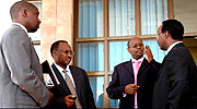 Rwanda Development Bank Director Thu00e9ogu00e8ne Turatsinze (L), Protais Musoni, Local Government minister, Finance and Economic Planning minister James Musoni and Eng. Albert Butare, the Energy and Communication state minister at Prime Holdings.(Photo/G. Barya)