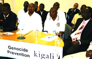 Kaboyi (left) speaking during the teleconference at British Embassy offices in Kigali, while Rutimburana (3rd from left) and other participants have their eyes fixed on the screen. (Photo/G. Muramila)