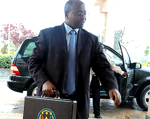 Finance Minister James Musoni arrives at Parliament to present the 2008 Budget estimates yesterday. (Photo/ G Barya)