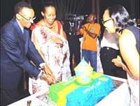President Paul Kagame is joined by Mrs Jeannette Kagame as he cuts his birthday cake at a party organised by Unity Club in celebration of his 50th birthday on Tuesday at Village Urugwiro.(PPU Photo)