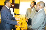 Tanzanian Minister for Infrastructure Development, Minister of Infrastructure Development Engineer August B Kowero speaks to Eng. Butare (centre) Dr Edmund Katiti (R), the Policy and Regulatory Advisor for the Nepad e-Africa Commission, at Serena H