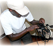 CAUGHT IN THE ACT:  This man was captured by the lenses trying to peep into a ladyu2019s bag. (Photo/ J. Mbanda)