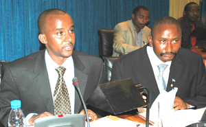 Karongi mayor Kayumba (left) and his Nyabihu counterpart Charles Ngirabatware  at Parliament yesterday. (Photo/J. Mbanda)