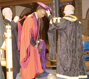 Kagame being conferred upon the honorary doctorate.