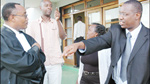 L-R: PL lawyers J.B Kazungu and Serge Kayitare with Odette Nyiramirimo and Mitali outside court. (Photo / J. Mbanda)