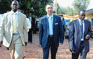 L-R: Rwandatel Chief Executive Officer Patrick Kalingufu, Lap Green Managing director Abdulbaset Elazzabi and  Twahirwa tour Rwandatel offices shortly before signing the companyu2019s technical handover to the Libyan telecom firm yesterday. (Photo/G. Barya)