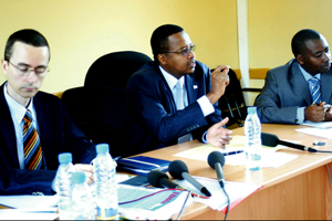 Dr. Innocent Nyaruhirira, addressing the press yesterday at the Treatment and Research Aids Centre (Trac) offices in Kigali. Left is Prof. Mike Kramer, the head of Trac Plus Unit, and Vianney Nizeyimana, the in-charge of infectious diseases at Trac.