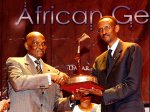 President Kagame (right) receiving the 2007 African Gender Award from his Senegalese counterpart Abdoulaye Wade at the Daniel Sorano Theatre in Dakar, Senegal. (PPU Photo)