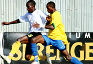 BATTLE: Rwandau2019s Donatien Tuyizere battles with Ugandau2019s Vincent Kayiizi on Tuesday. Uganda won 2-0 but Rwanda out of disappointment whipped Dibouti 9-0 yesterday.