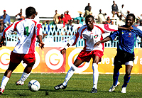 Burundiu2019s Hussein Ndeyimana (left ) keeps the ball as team-mate Hassan Hakizimana shields away Tanzaniau2019s Danny Murwanda in Dar Saturday (Courtesy Photo)