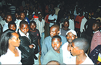 Hawkers and pedestrians gather around The New Times reporter (left) who rushed to the scene shortly after the incident. (Photo/G. Barya)
