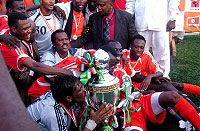 Sudanu2019s goal keeper Akram Elhadi Salim kisses the Cecafa Challenge Cup Trophy. Sudan beat Rwanda on spot-kicks to claim its second title after twenty seven years. (Photo/B. Mugabe)