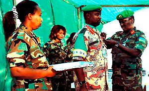 Gen. Karake decorating Col. Emmanuel Ruvusha in Darfur recently. (Courtesy photo)