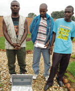NABBED: L-R: Gilbert Wanyama, Michel Nikiza and Jean Paul Uwayezu were caught with counterfeit dollars at CID offices yesterday. (Photo / J.Mbanda)