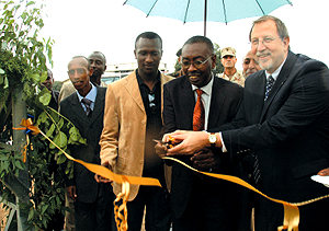 Ambassador Arietti with Secretary General Narcise Musabeyezu cutting the ribbon at the opening of Shyara Primary School (inset) whose construction was funded by the US Department of Defense, European Command. (Photo/G. Barya)