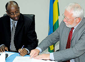 Musoni and David MacRae ( right) at the signing ceremony yesterday.(Photo/J. Mbanda)