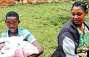 SELLER and BUYER: Clementine Uwase (with baby) and Brigitte Kampire at Nyamirambo Police Station yesterday. The former had sold her baby for Frw100,000. (Photo/ J. Mbanda)