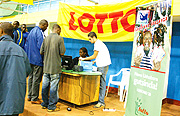 Customers registering at the Lotto Remera office.