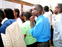 Students checking on SFARu2019s 2008 loans list in Kigali.